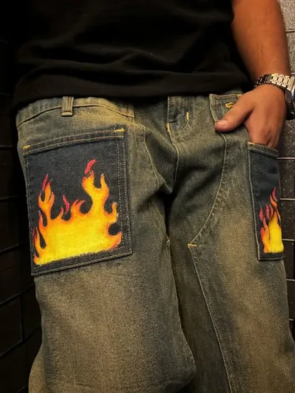 Another shot of the flame jeans, showing how the painted pockets add a pop of color and personality to an everyday pair of pants.