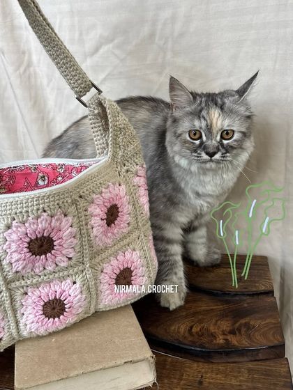 Even our cat approves. The Blossom Meadow bag is a charming addition to any home and wardrobe.
