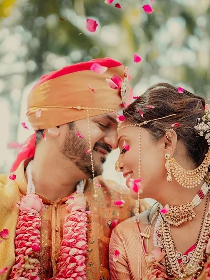Showered in petals and love, this is the kind of intimate, joyful moment I live to capture. This close-up from a Maharashtrian wedding shows the pure happiness and connection that makes each story unique.