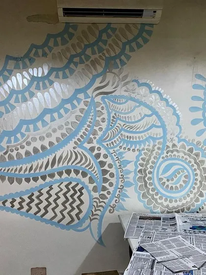Another perspective of the 'Subtle Charm of Delhi' mural. The design flows from one end of the room to the other, creating a sense of continuous, gentle movement.