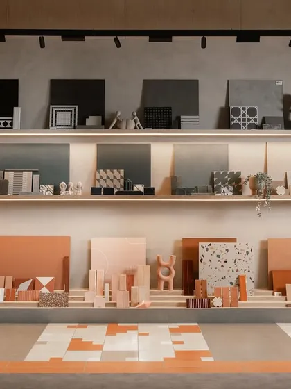 The main display wall at the Trove showroom is a curated arrangement of tiles and material samples. We designed tiered wooden shelves with integrated lighting to showcase the products like pieces in a gallery.