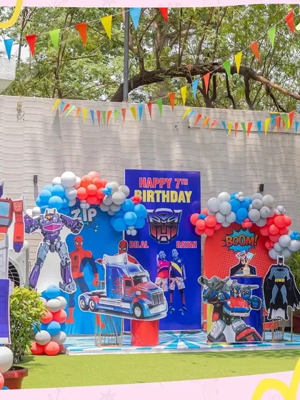 An action-packed party for a 7th birthday, combining the worlds of Transformers and superheroes. This setup is perfect for kids who love epic adventures and their favorite characters.