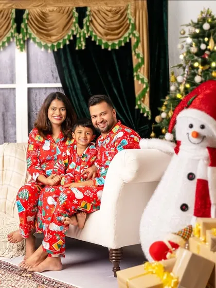 Another beautiful family portrait, with everyone in matching pajamas, sharing smiles and creating lasting Christmas memories.