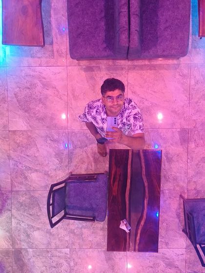 A top-down selfie in a cafe, showing one of my river tables installed in a commercial space.