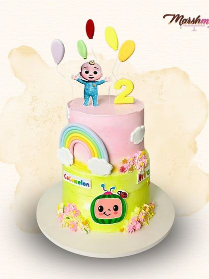 Another adorable Cocomelon cake, this one celebrating a second birthday. It features JJ, the iconic watermelon, and a colourful rainbow, all in sweet pastel shades.
