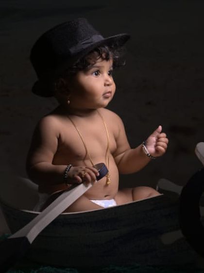 Explore our full nautical and beach-themed collection. These images showcase the variety of poses and angles possible with our boat prop, sand-colored flooring, and ocean backdrop.