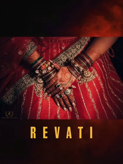 A detail shot of the bride's hands, showcasing the intricate henna design and the beautiful bangles and rings that are part of her bridal ensemble.