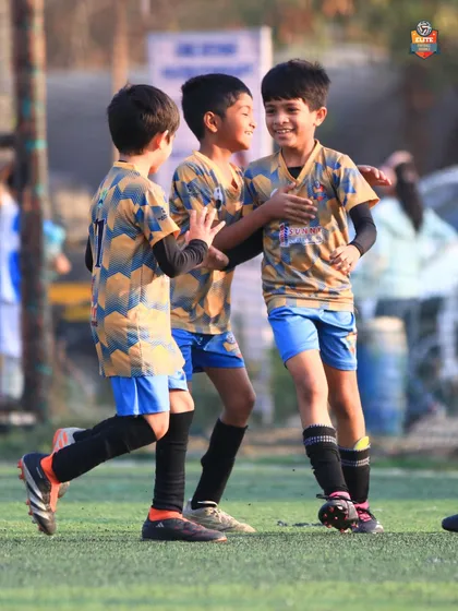 The pure joy of football. Our young players celebrating a goal together, building bonds that last a lifetime.