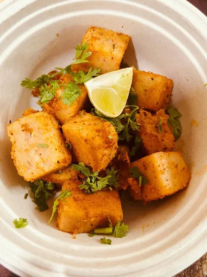 Here, the lentil tofu is lightly sautéed with spices and garnished with fresh coriander and a squeeze of lime. This preparation makes for a delicious, high-protein snack or a side dish.