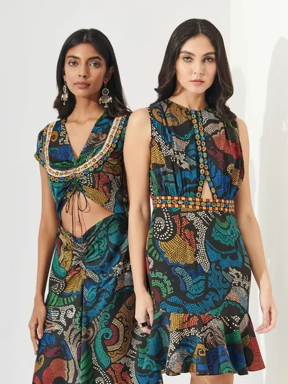 Two models in contemporary printed outfits. Their makeup is fresh and modern, with glowing skin and defined eyes, showcasing looks that are perfect for bridesmaids or wedding guests.