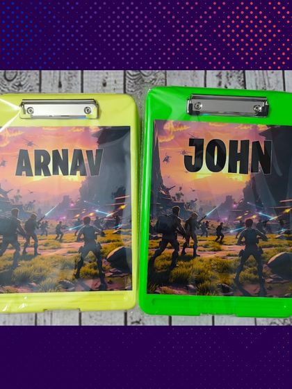 A closer look at the action-themed storage clipboards, personalized with the names Arnav and John. They are both stylish and functional.