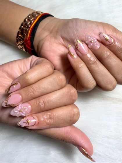 Another angle to appreciate the delicate craftsmanship of the FiDi floral nail art.