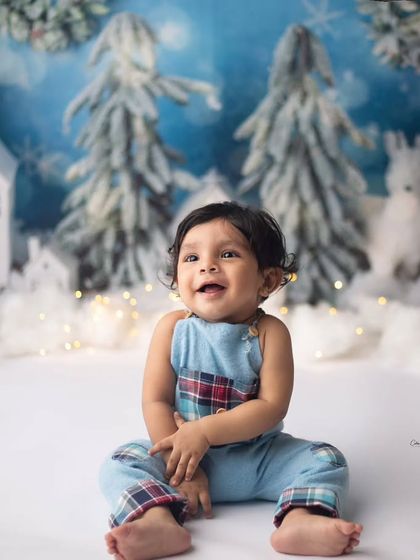 He came to melt my heart. This little guy's beautiful smile lights up the whole winter wonderland scene.