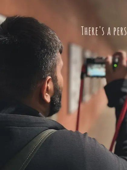 A behind-the-scenes shot of me, the photographer, lining up a shot in the same underpass. It shows the person behind the camera.
