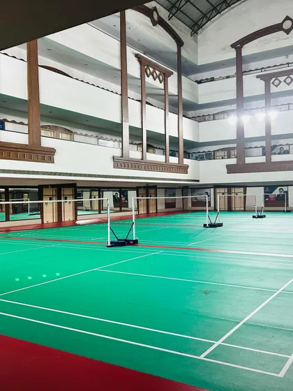 A clear view of one of our professional-grade synthetic badminton courts. We provide a top-tier, well-lit indoor environment so you can focus completely on your training without any distractions.