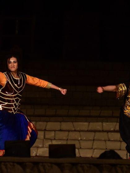 The dynamic energy of a live performance. This shot captures the intensity and drama of the scene between our characters on stage.