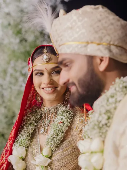 A close-up of the bride looking at her groom with a gentle smile. These are the quiet, intimate moments of connection that we cherish and strive to create the perfect setting for.