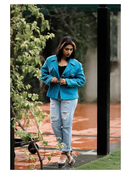 A walking shot that gives the outfit a sense of movement and energy.