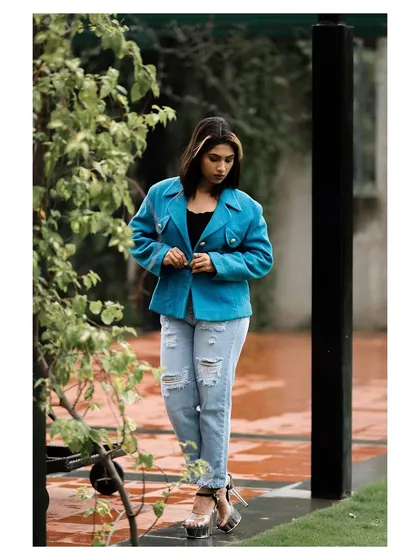 A walking shot that gives the outfit a sense of movement and energy.