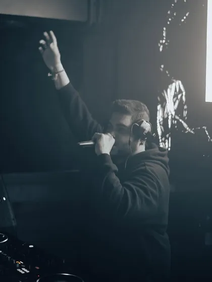 A powerful moment on the mic, commanding the attention of the room.