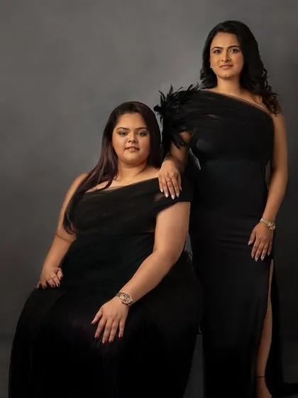A celebration of friendship in elegant black gowns. This portrait is a beautiful way to honor the special bond between two friends, creating a memory they can share forever.