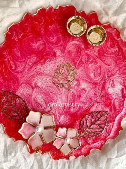 Another view of the pink pooja platter, this time with a Ganesha motif. The 3D flowers and gold accents make it extra special.