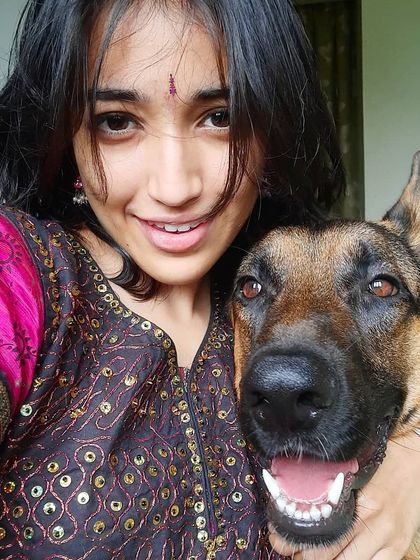 Celebrating Vijayadashami with my best boy. We even manage to twin with our expressions. Life with a dog is full of these silly, happy moments.