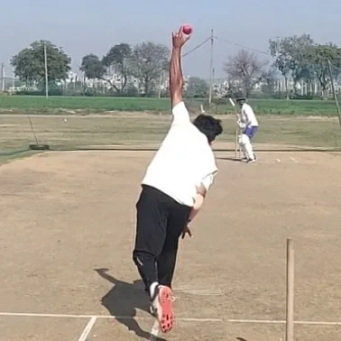 The release is a crucial point for any spinner. Here you can see the perfect high-arm action needed to get maximum spin on the ball.