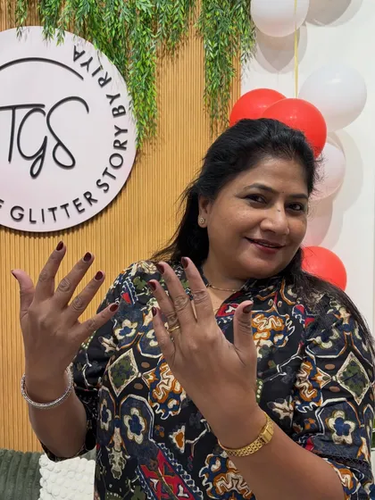 It's always a joy to pamper clients of all ages. She looks so happy with her classic, deep red manicure.