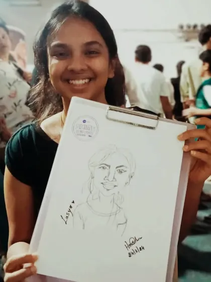 Meet Lasya. Her smile is so genuine. This was taken at a busy event, where I love to set up and draw.