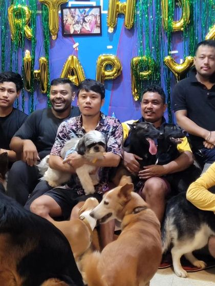 The team and the pack celebrating together. This is what family looks like.