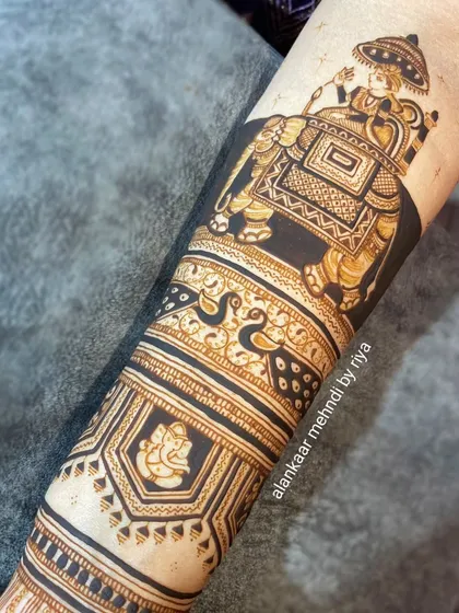 A close-up of the groom on the elephant, part of a larger baraat-themed bridal mehndi.