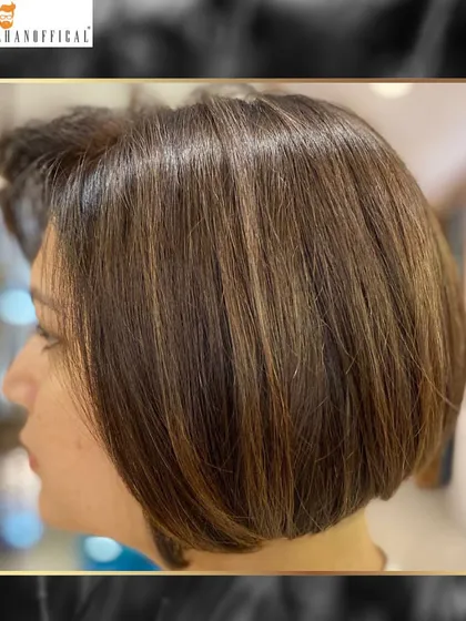 Another look at the chic bob with spun gold highlights. This style is a perfect example of how color can elevate a classic haircut.