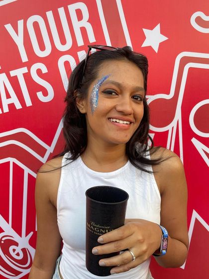 The client enjoying the festival with her custom glitter. My art is designed to last through a whole day or night of fun.