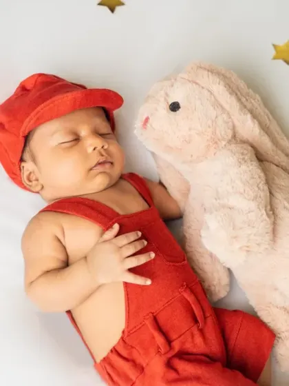 A sweet newborn cuddles with his favorite bunny friend. We love incorporating special toys to make the photoshoot even more personal.