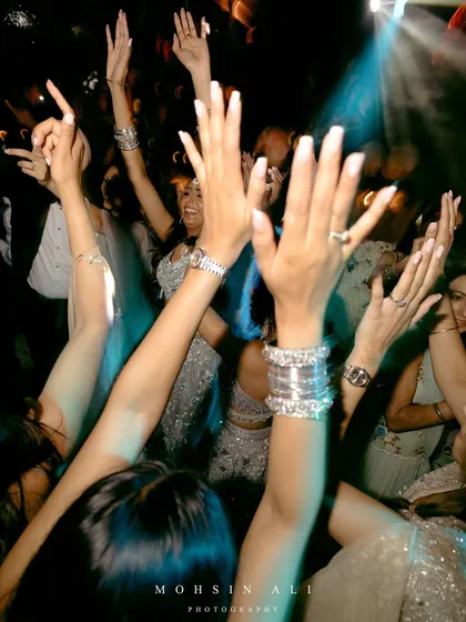 Hands in the air on the dance floor in Tuscany. This is what it's all about, a joyful crowd celebrating together.