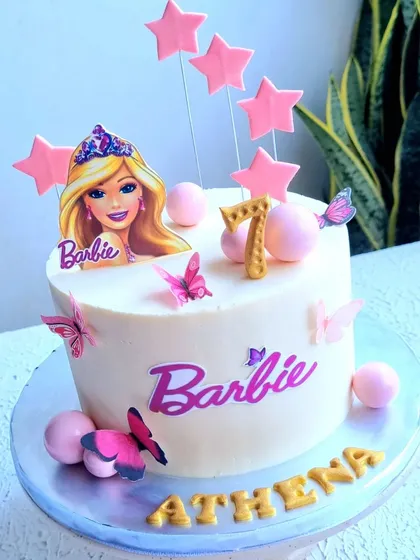 A simple and sweet Barbie cake with a buttercream finish. This design uses edible images and wafer paper butterflies for a quick but beautiful result.