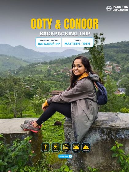 A solo traveler enjoying the view from a wall on our Ooty & Coonoor trip. It's a perfect blend of sightseeing and relaxation.
