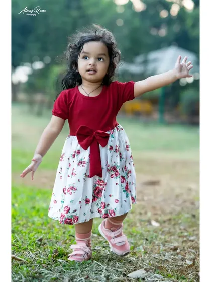 Taking her first steps into a new year. This full-length shot of Riona shows her in motion, capturing the energy and spirit of a two-year-old during her outdoor birthday session.