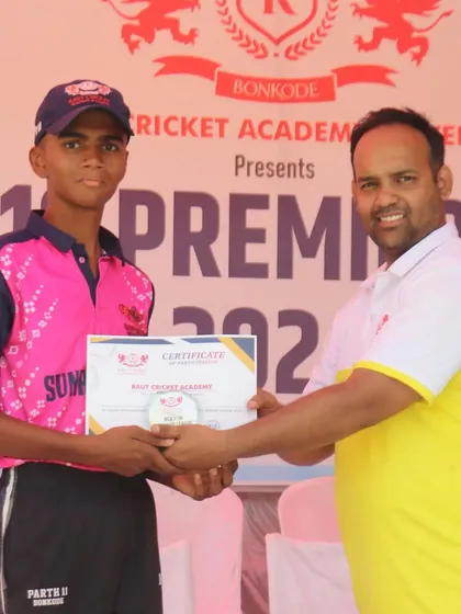 A young cricketer from the Sunrisers RCA team is acknowledged for his participation.