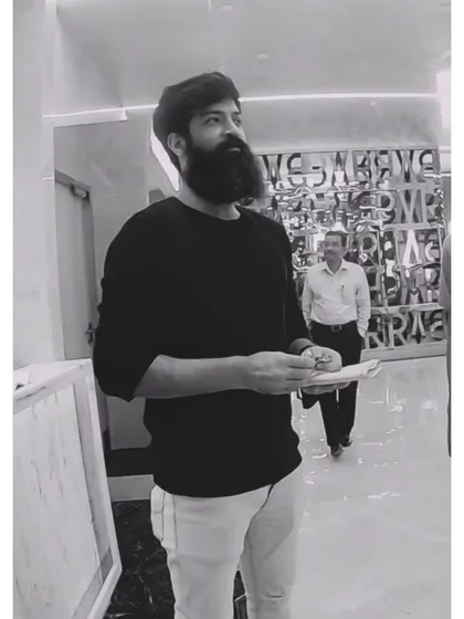 A candid shot from the PVR shoot, reviewing notes between takes. Directing choreography requires constant planning and adaptation.