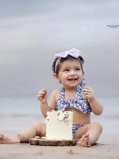 Pure happiness is a baby, a beach, and a birthday cake. This little mermaid enjoyed every sandy, sugary moment of her outdoor cake smash session.
