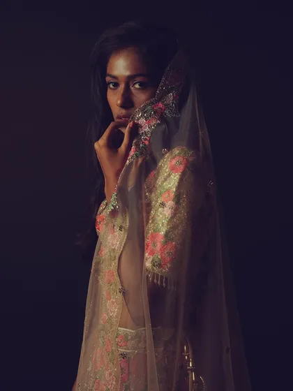 A final artistic shot from the series, with the model partially veiled by her dupatta, creating a sense of mystery and elegance.