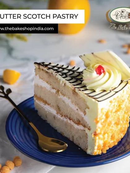 A classic Butter Scotch Pastry, with layers of light sponge, creamy frosting, and crunchy butterscotch bits.