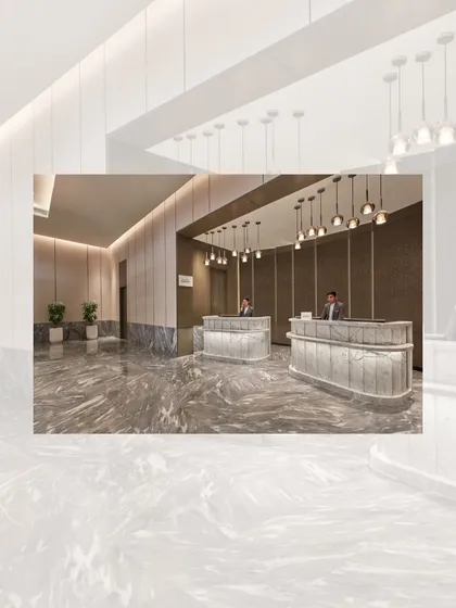 The sleek and modern reception desk at the Courtyard by Marriott. I used marbled stone for the desks and floors, complemented by contemporary pendant lighting to create a sophisticated and welcoming first impression.