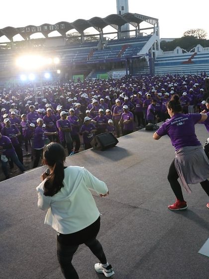 Leading the warm up session from the main stage at Kanteerava Stadium. Getting the crowd's energy up before a big race is a crucial part of my role as a marathon host.