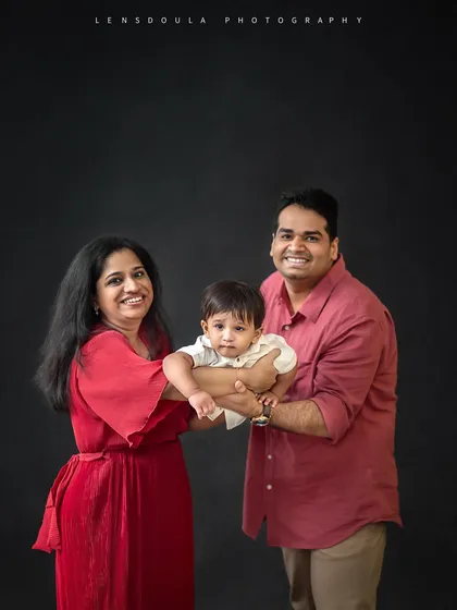 A playful "airplane" pose with mom and dad. These fun, interactive shots are a great way to get genuine smiles from little ones.