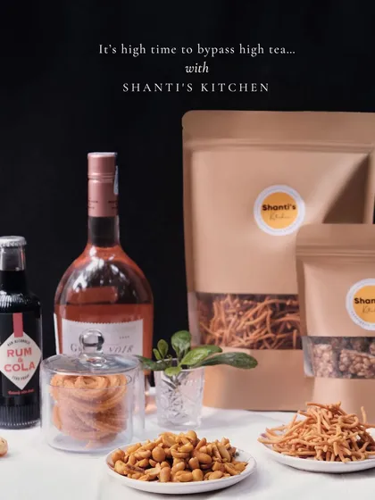 My snacks are not just for tea time. They are a wonderful accompaniment to any beverage of your choice. Here, my spicy peanuts and crunchy murukku are paired with evening drinks, proving that traditional flavors can be part of any modern celebration.