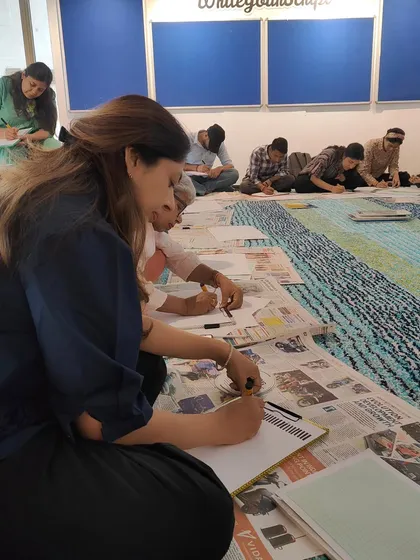 Participants deeply focused during a hands-on calligraphy workshop. We create a calm and inspiring atmosphere for creative exploration.