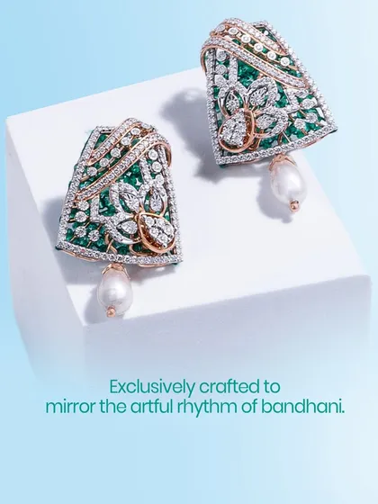 Exclusively crafted to mirror the artful rhythm of Bandhani, these earrings are a celebration of traditional patterns. The design features emeralds, diamonds, and a South Sea pearl for a touch of classic grace.